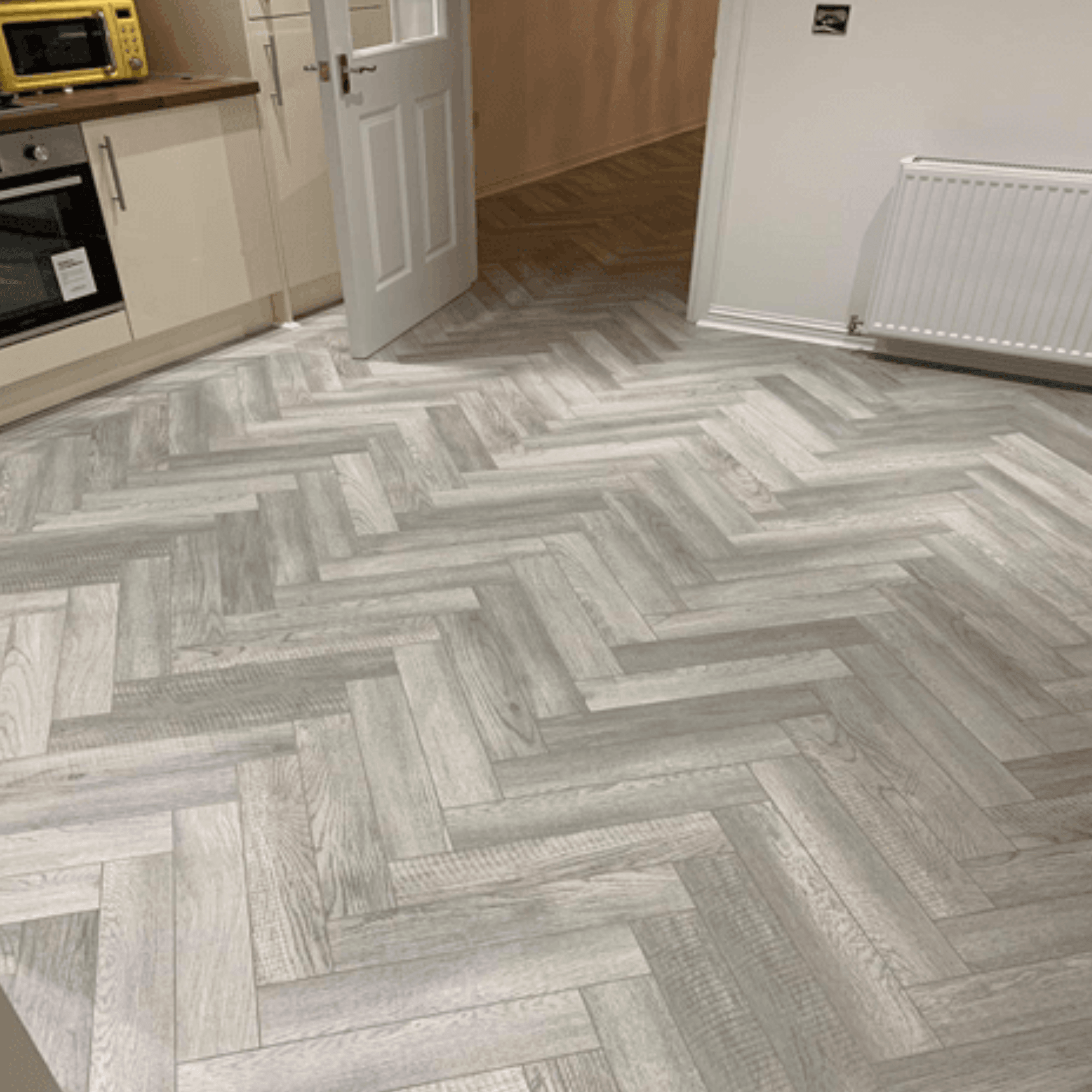 St James Park Laminate Herringbone Parquet Flooring – 12mm Thick – AC4 Rated